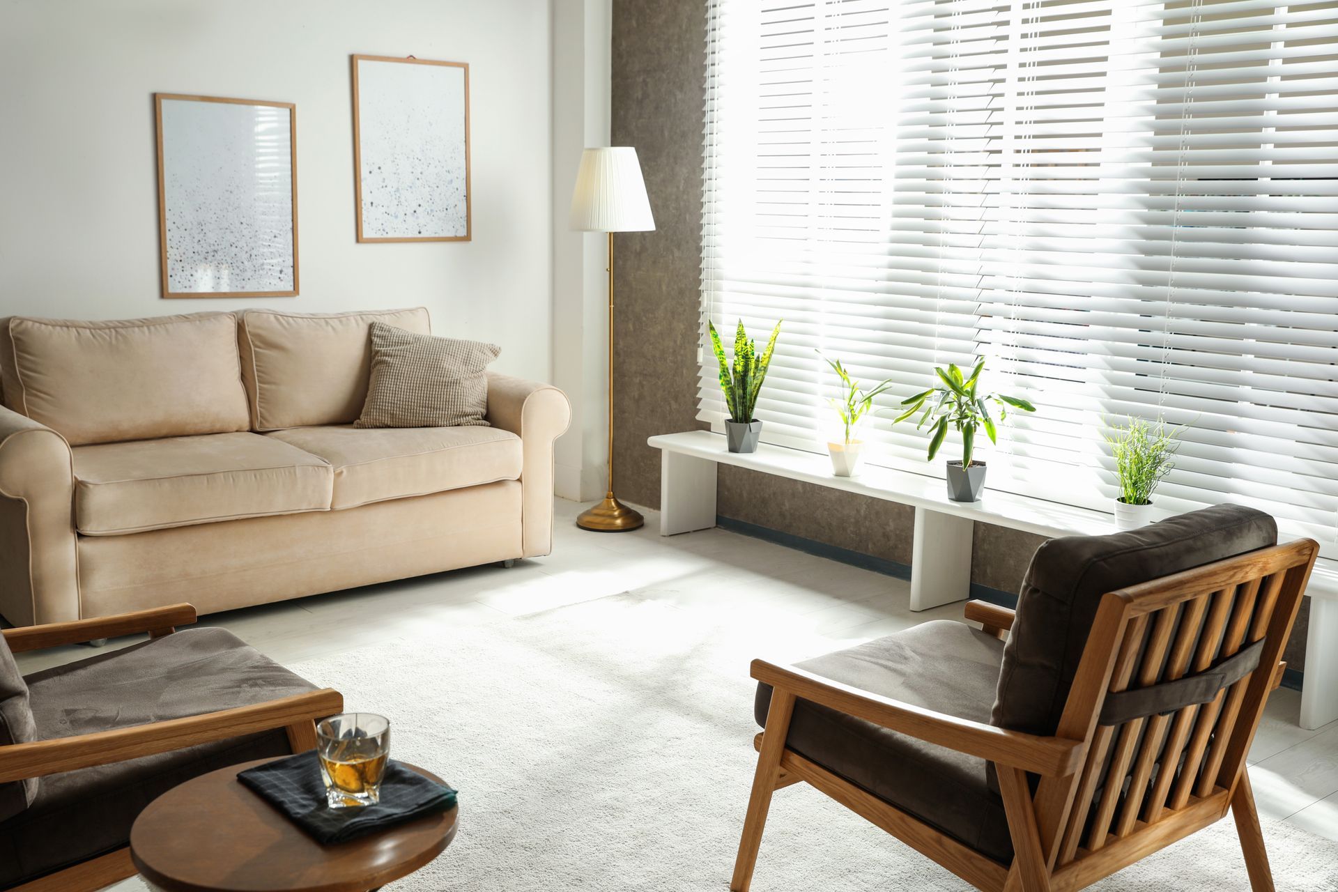 Mid century modern living room with loveseat, arm chairs, and custom blinds.