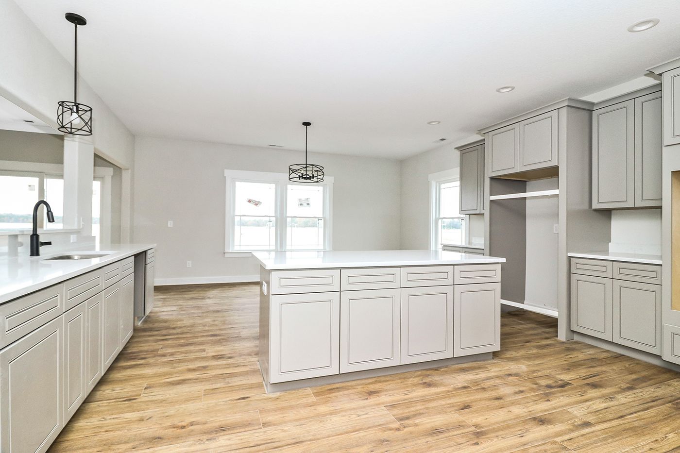 There is a large island in the middle of the kitchen.