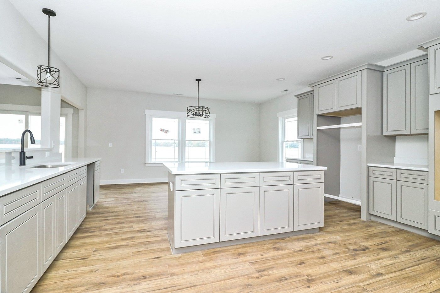 There is a large island in the middle of the kitchen.