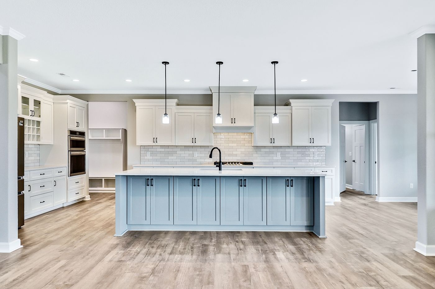 There is a large island in the middle of the kitchen.