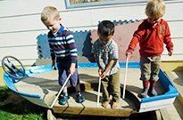 young boys playing on boat