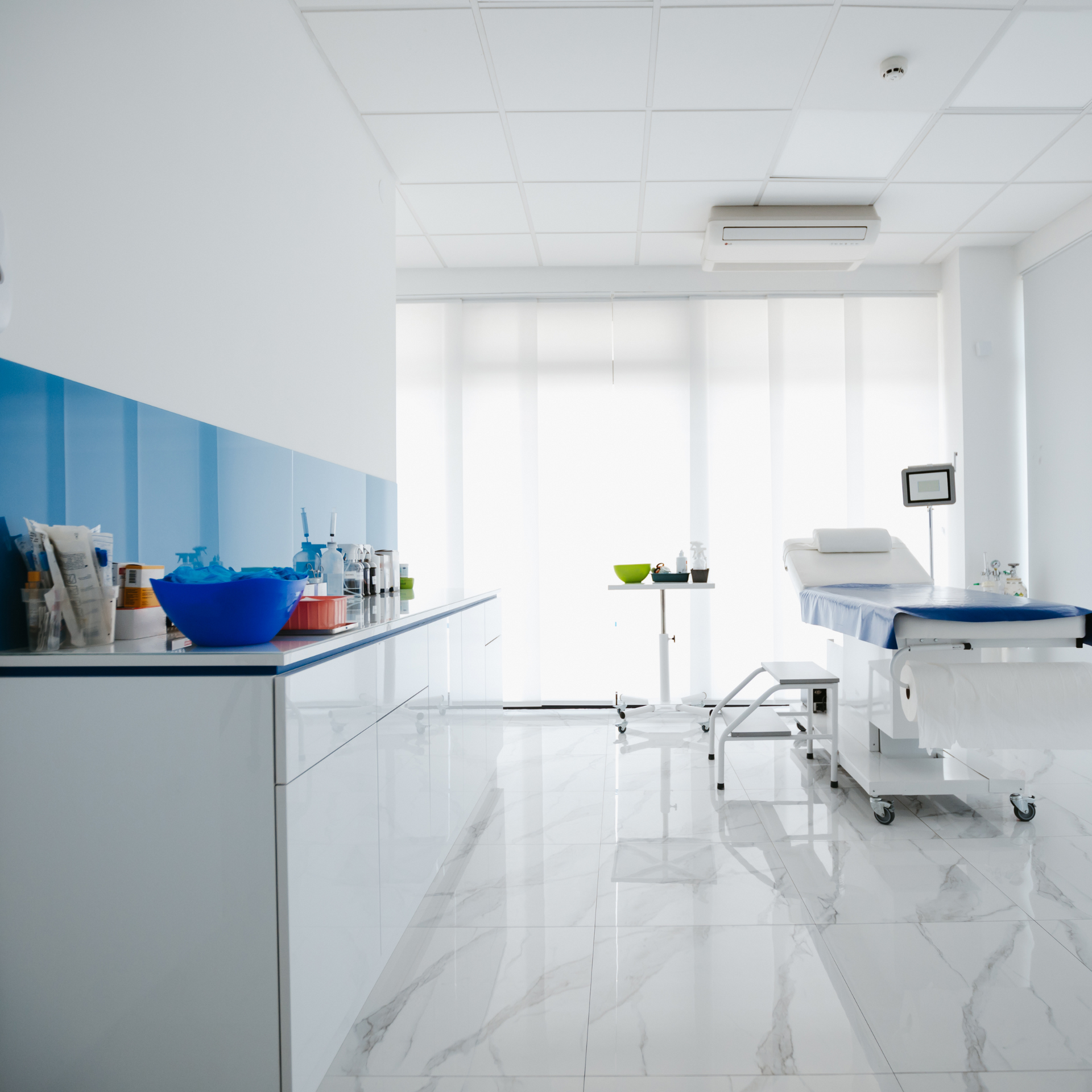 A white room with a blue wall and a table.