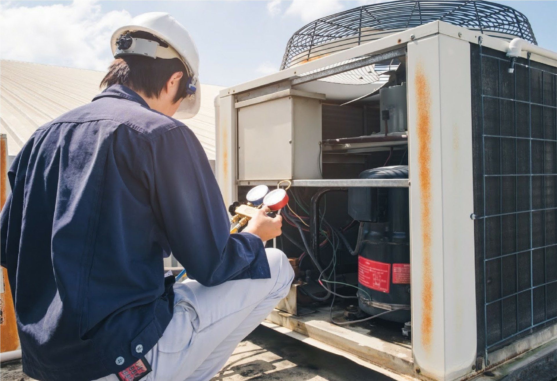 Technician Checking Air Conditioner — Fresno, CA — Art Douglas Plumbing Inc.