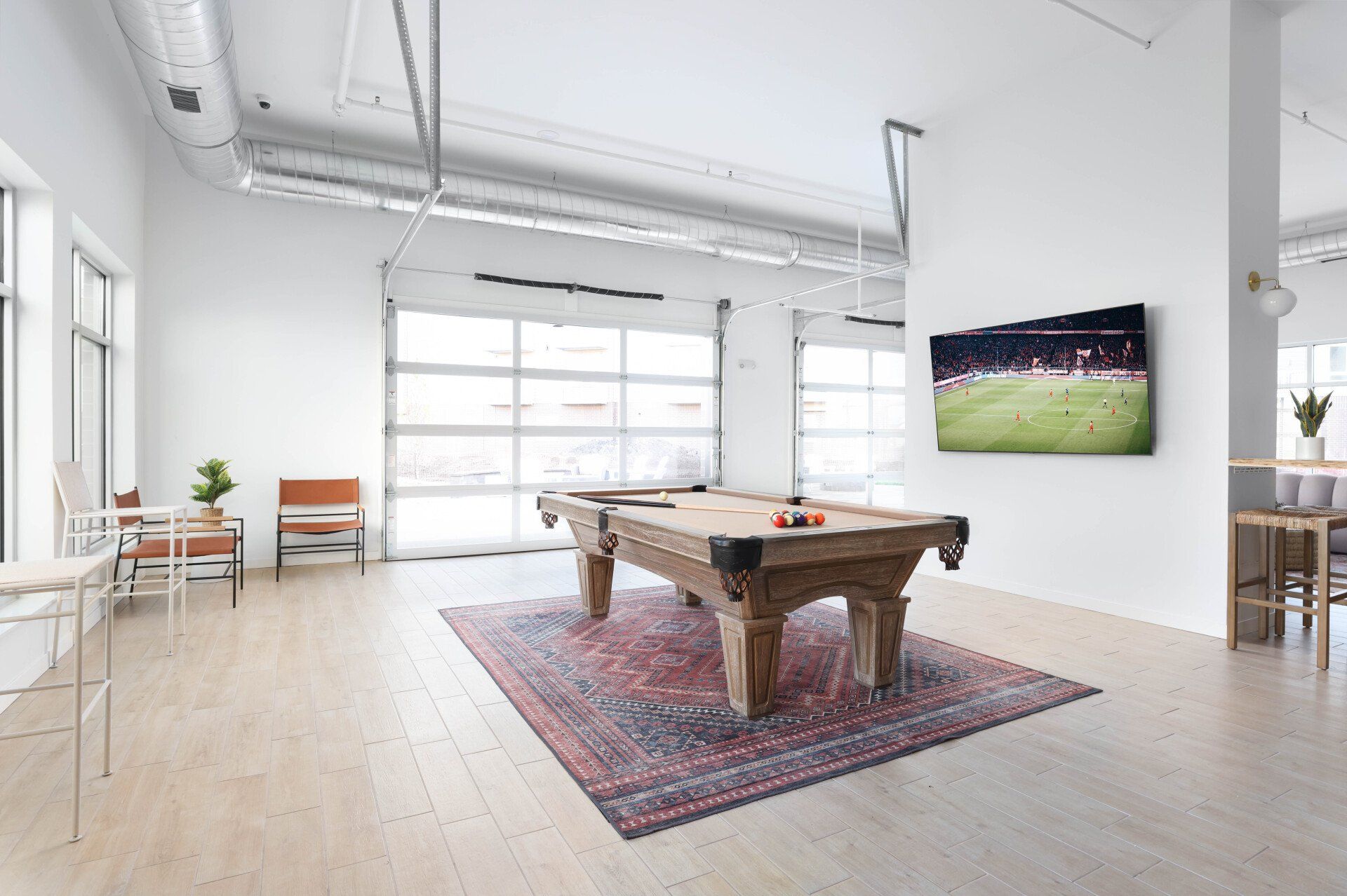 Pool table and TV in Community Room