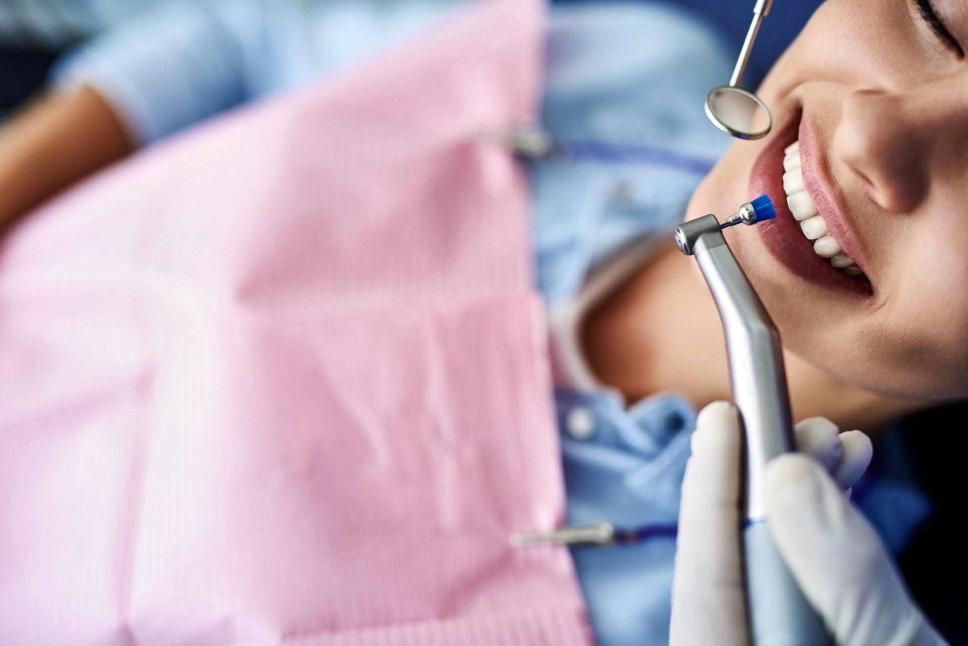 Women receiving dental cleaning 