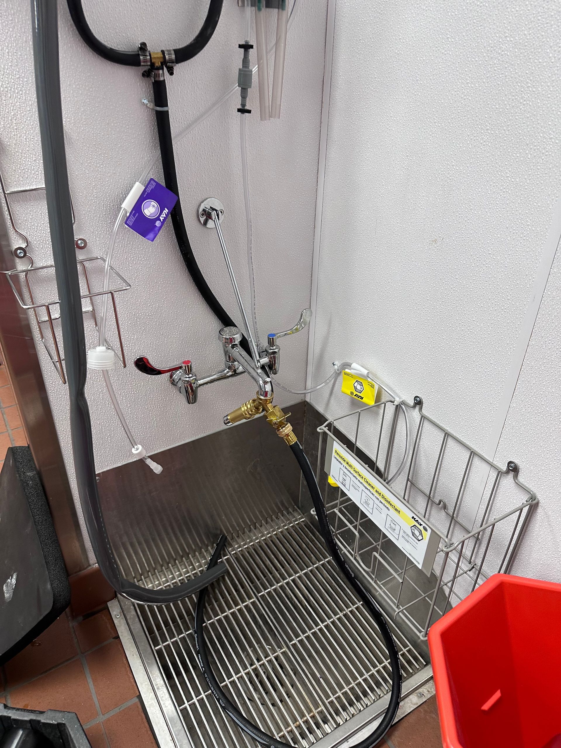 A kitchen with stainless steel appliances and white cabinets