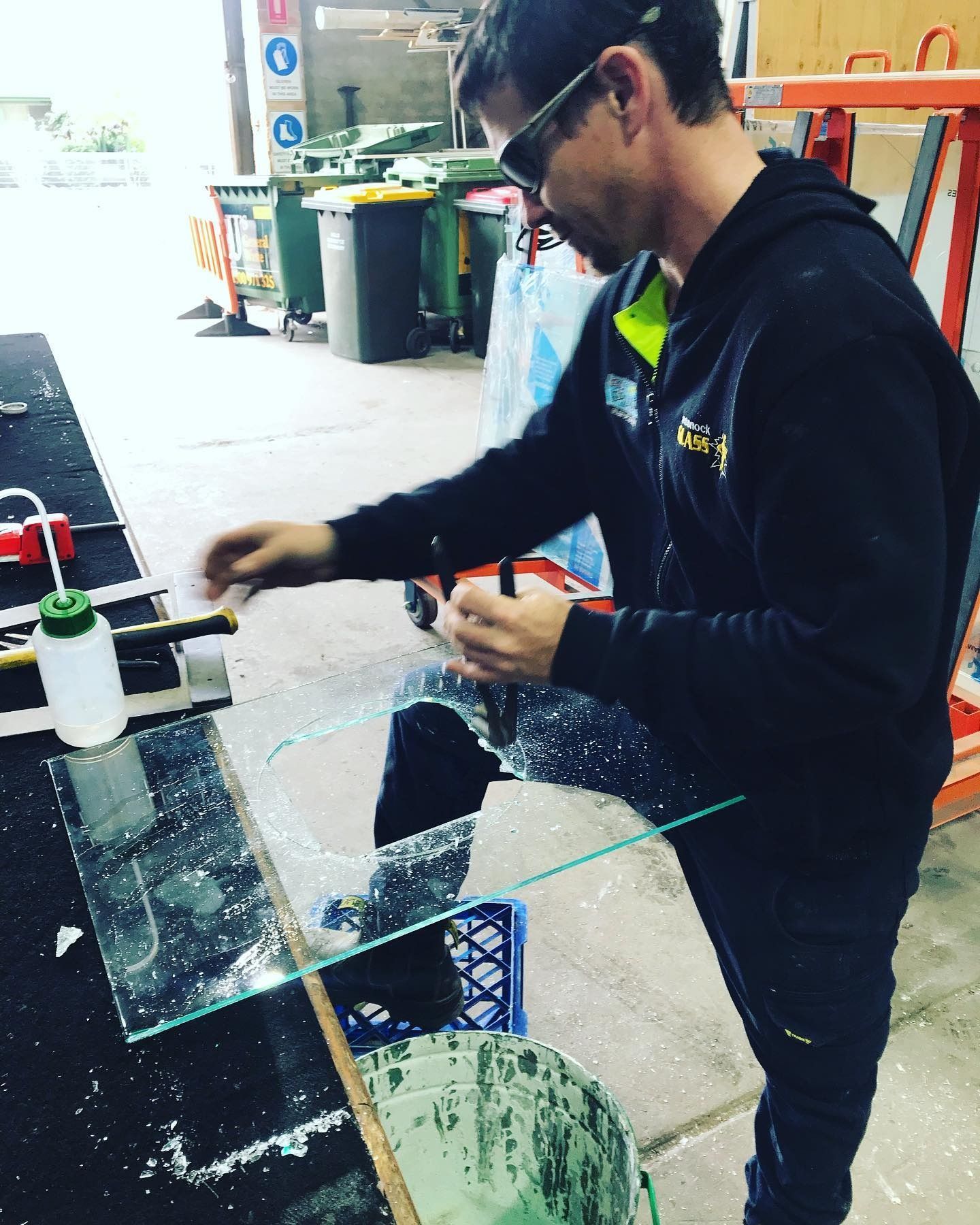 Glazier Grinding Middle Part of Glass Pane