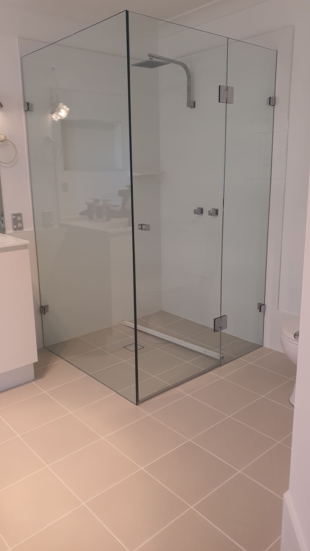 A Bathroom With a Walk in Shower and a Sink — Cessnock Glass in Cessnock, NSW