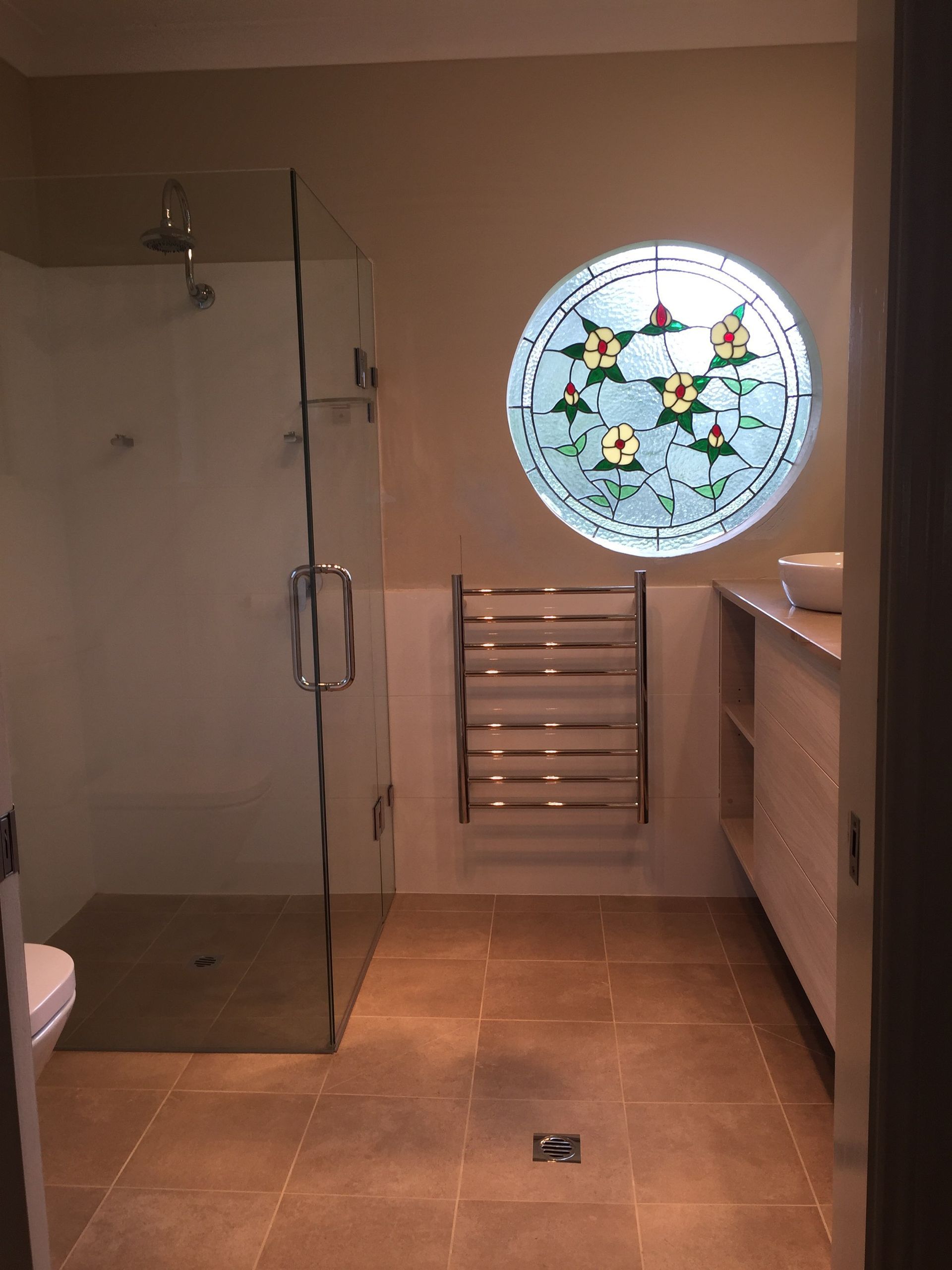 Bathroom With a Glass Shower, Round Stained-glass Window — Cessnock Glass in Cessnock, NSW
