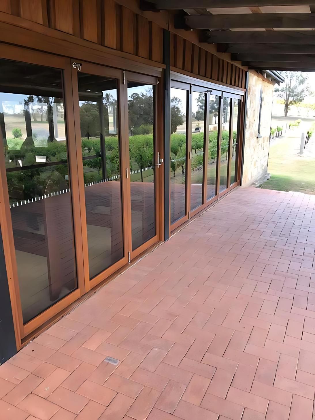 A Patio With a Lot of Windows and Bricks — Cessnock Glass in Cessnock, NSW