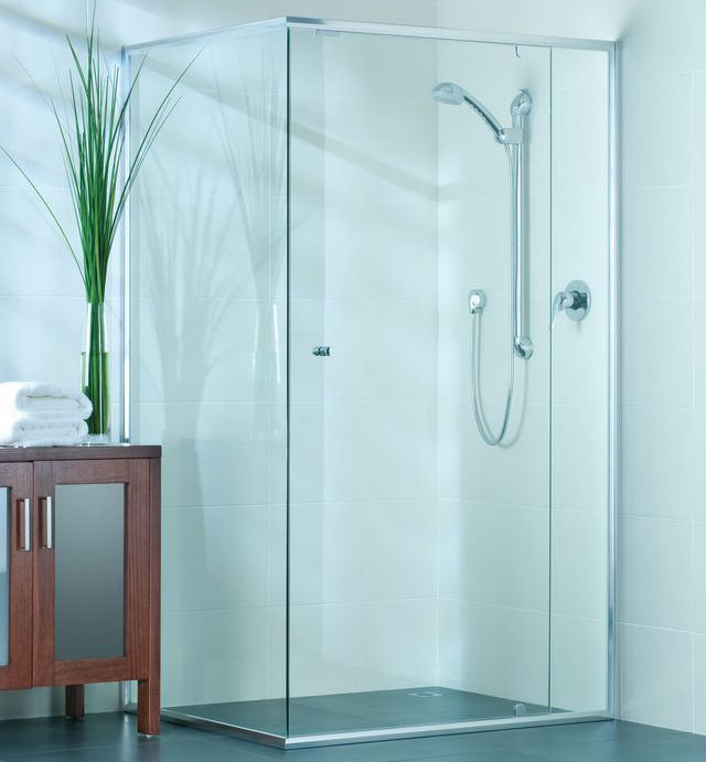 Glass shower enclosure with chrome fixtures in a modern bathroom — Cessnock Glass in Cessnock, NSW