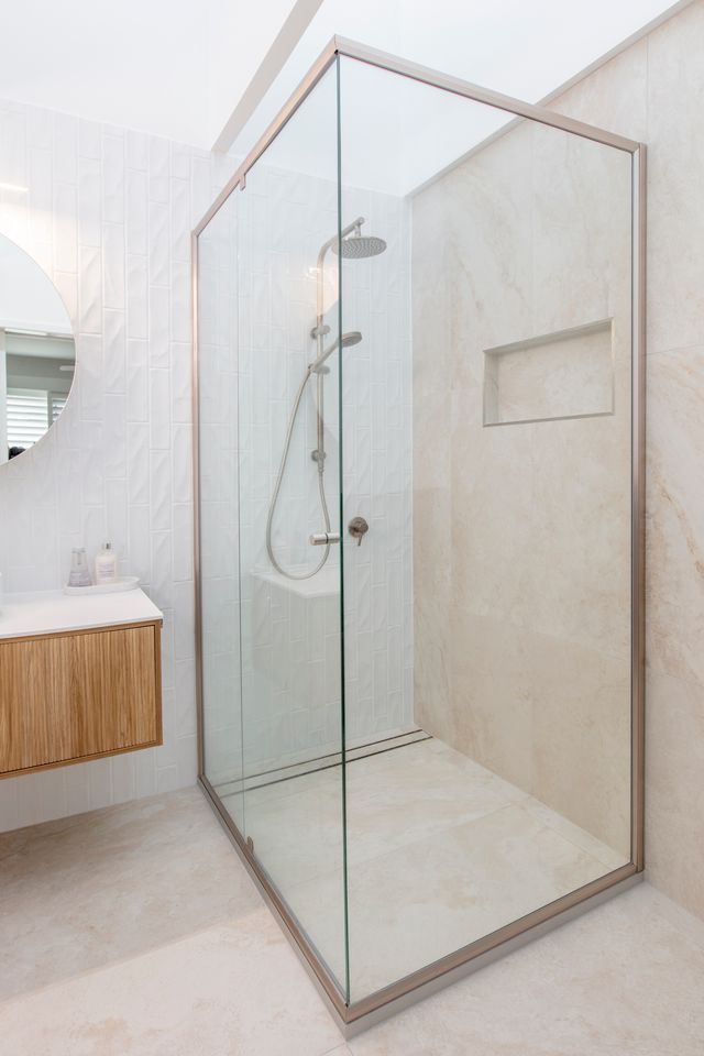 A Bathroom With a Walk in Shower With a Glass Door — Cessnock Glass in Newcastle, NSW