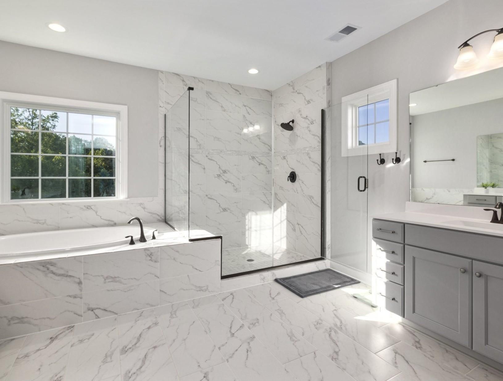 A Bathroom With a Walk in Shower , Tub , Sink and Mirror — Cessnock Glass in Cessnock, NSW