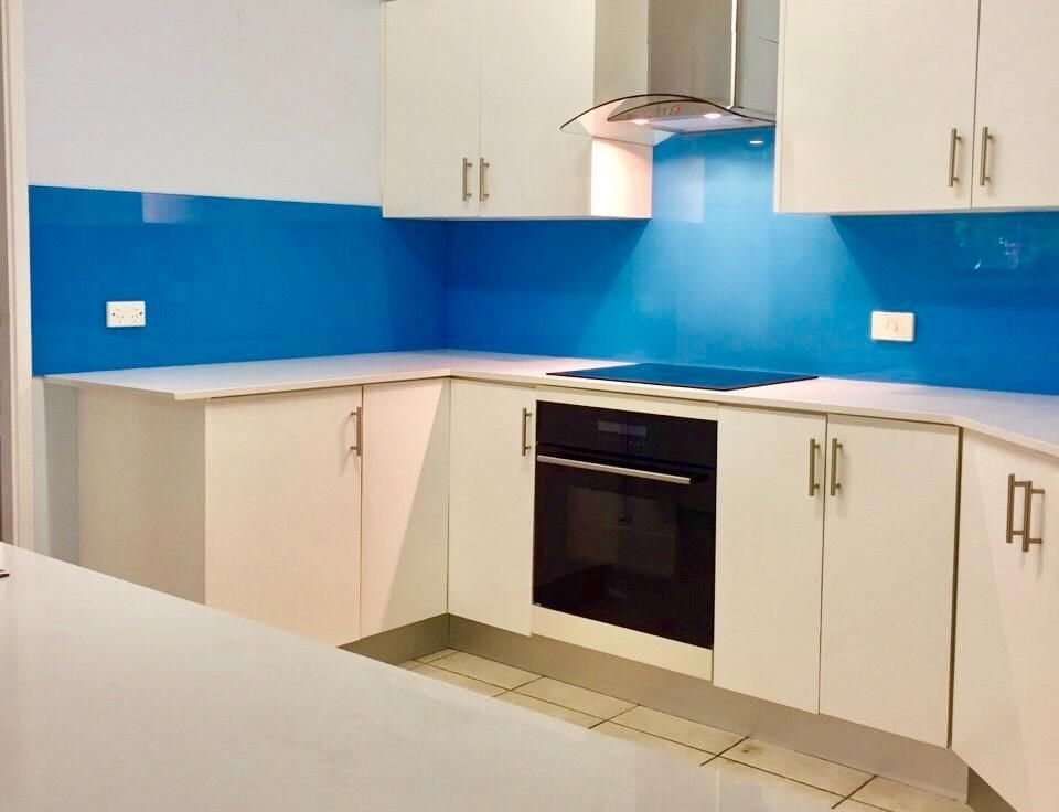 Blue splashback in a modern kitchen— Cessnock Glass in Cessnock, NSW