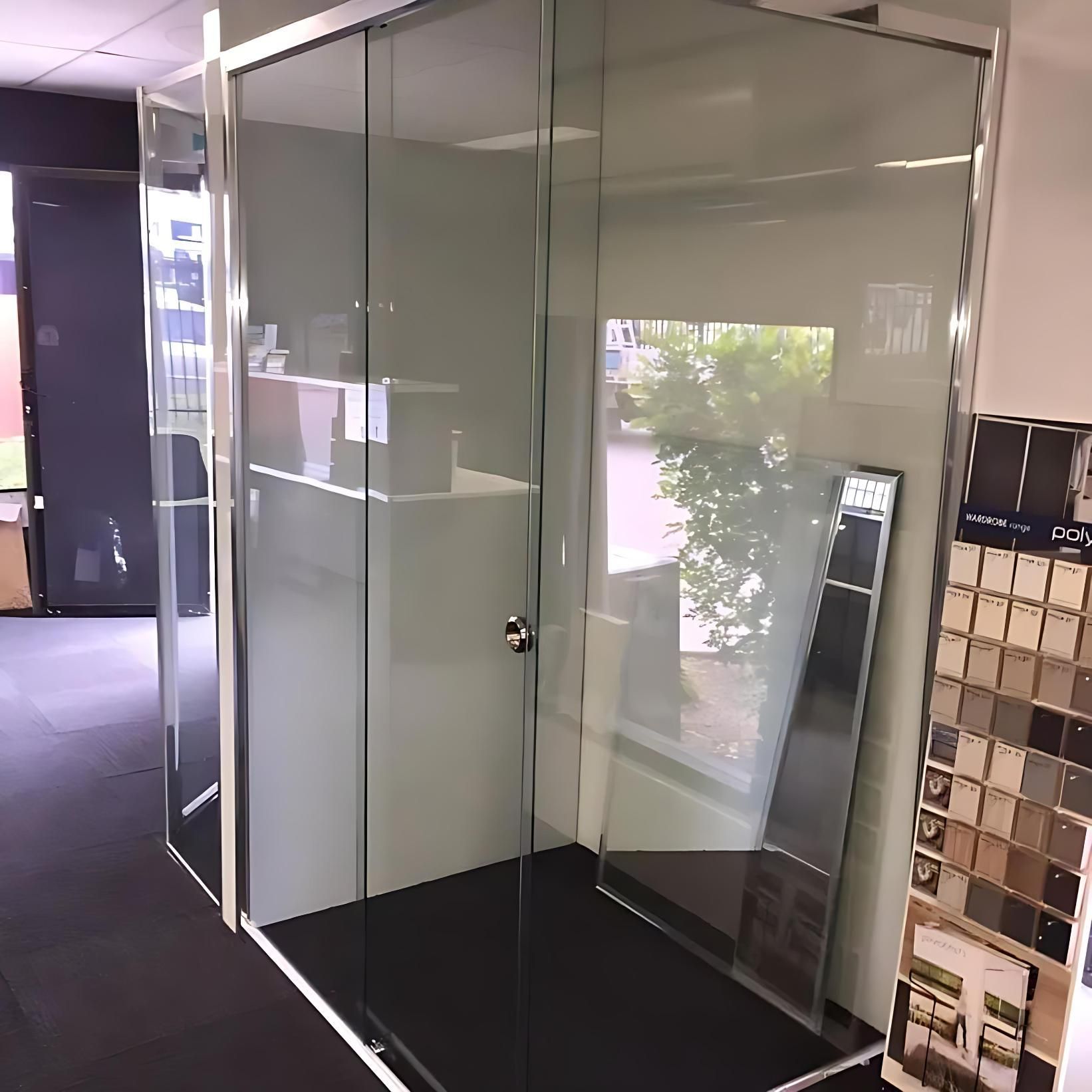 A Shower Stall With Sliding Glass Doors in a Store — Cessnock Glass in Hunter Valley, NSW