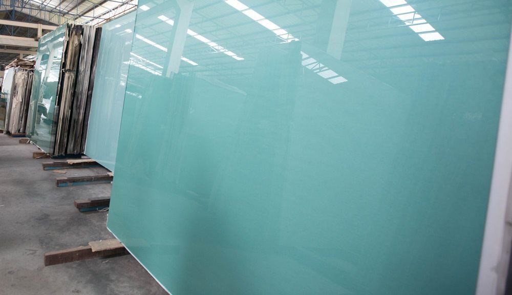 A Warehouse Filled With Lots of Green Glass — Cessnock Glass in Cessnock, NSW