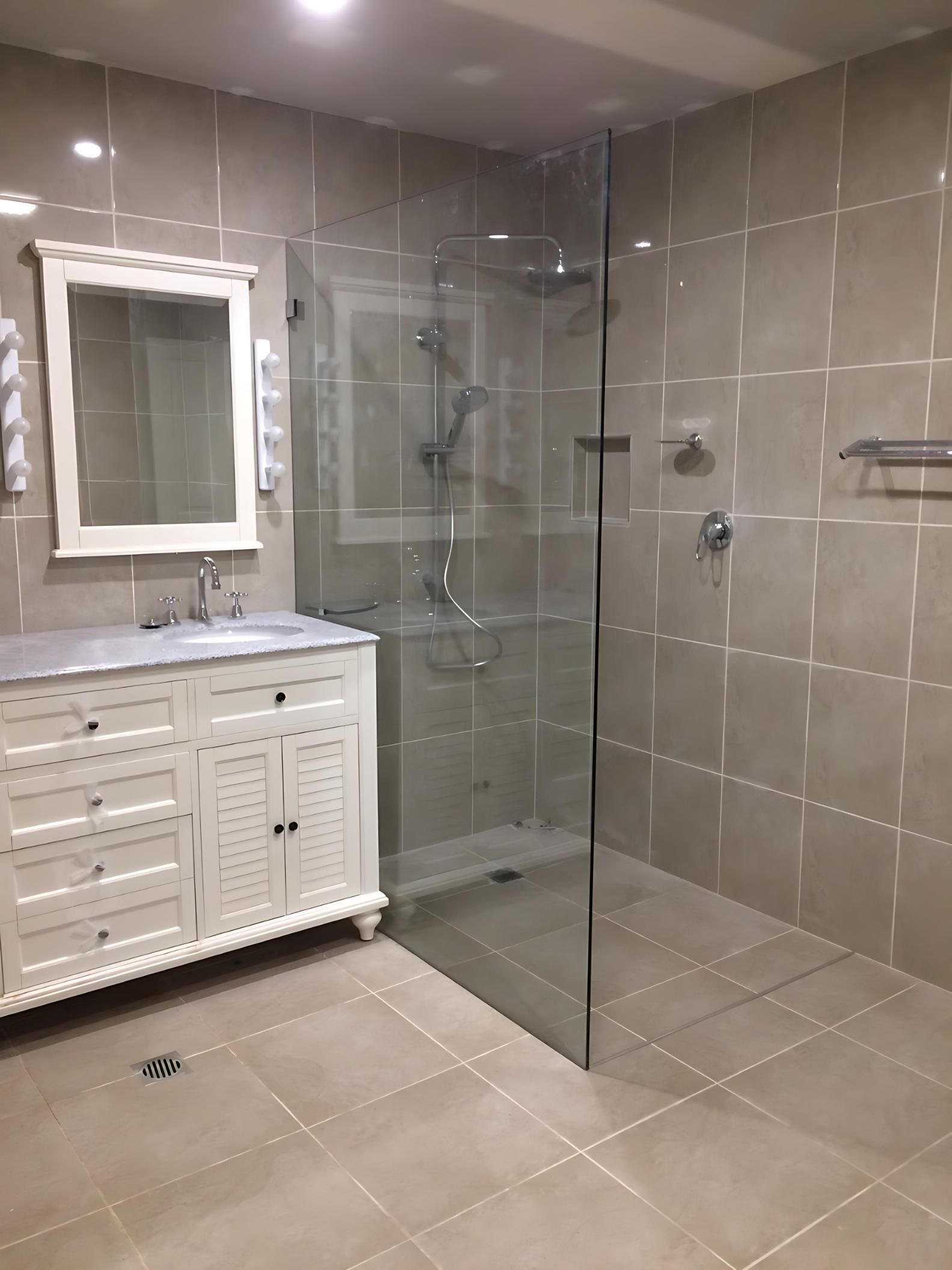 A Bathroom With a Walk in Shower, Sink, Mirror and Vanity — Cessnock Glass in Central Coast, NSW