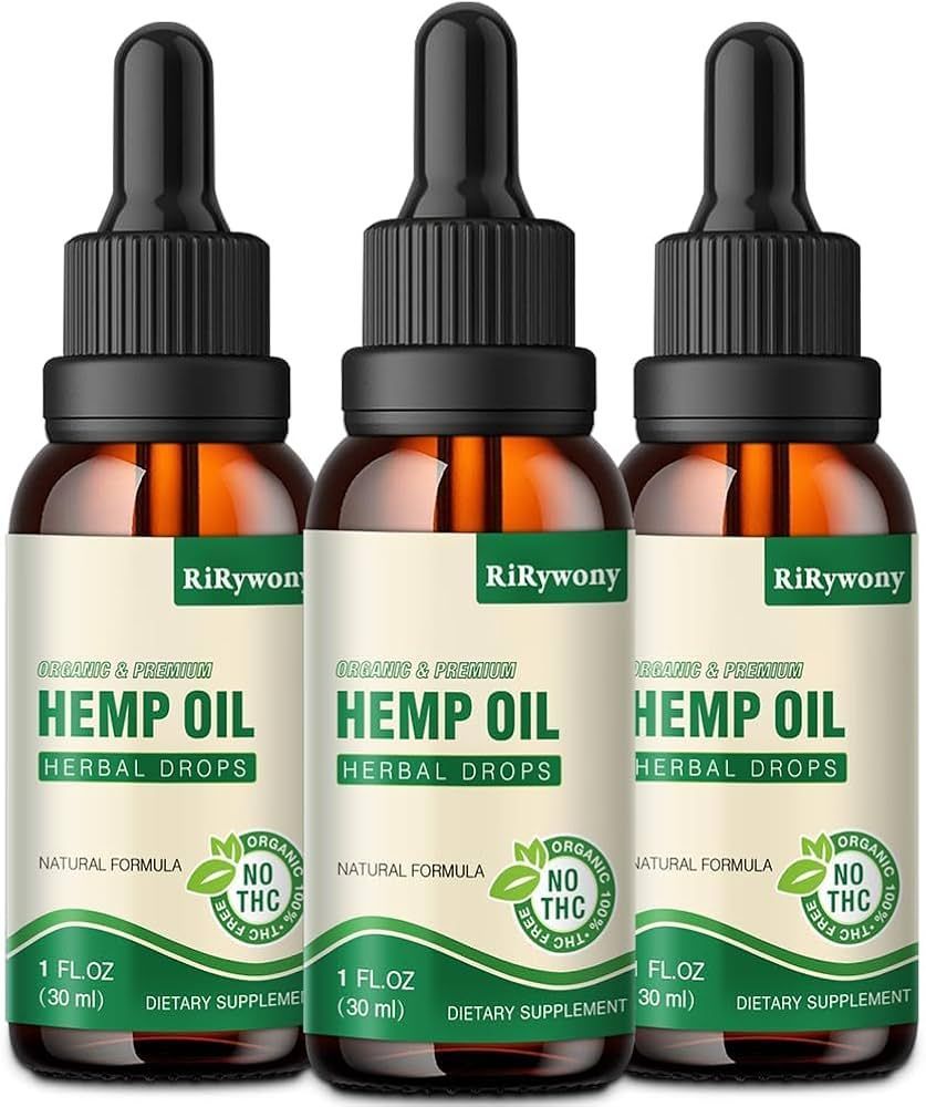 Three brown bottles of hemp oil with droppers and green labels.