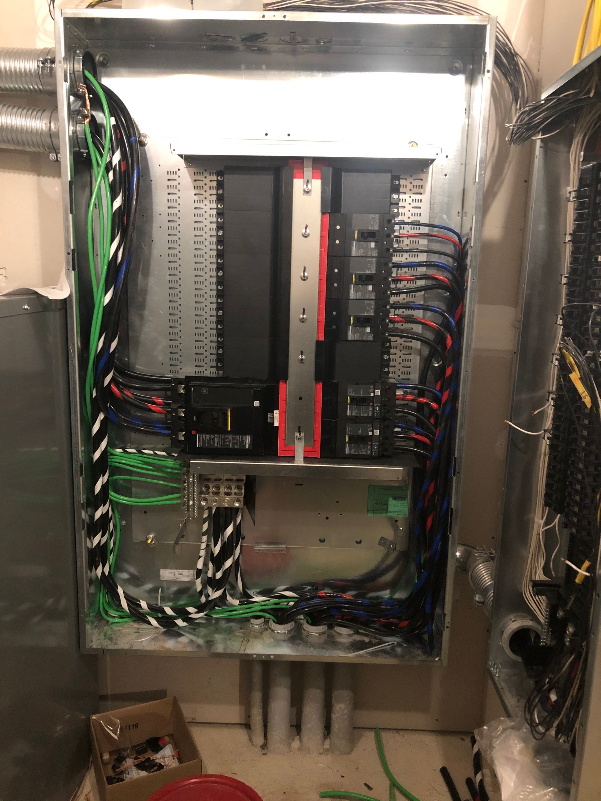 A large electrical box with a lot of wires coming out of it.