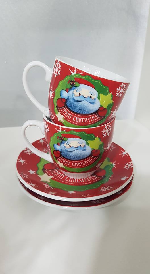 tazzine da caffè con Babbo Natale e fiocchi di neve