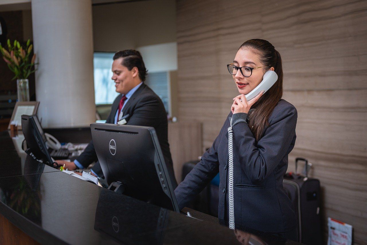 Image of a receptionist on the phone