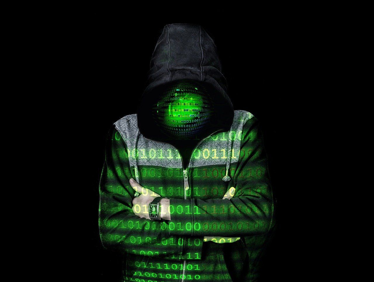 Image of an ominous looking person covered in binary code