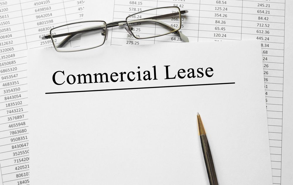 Paper with Commercial Lease on a table — Solicitors in Cessnock, NSW