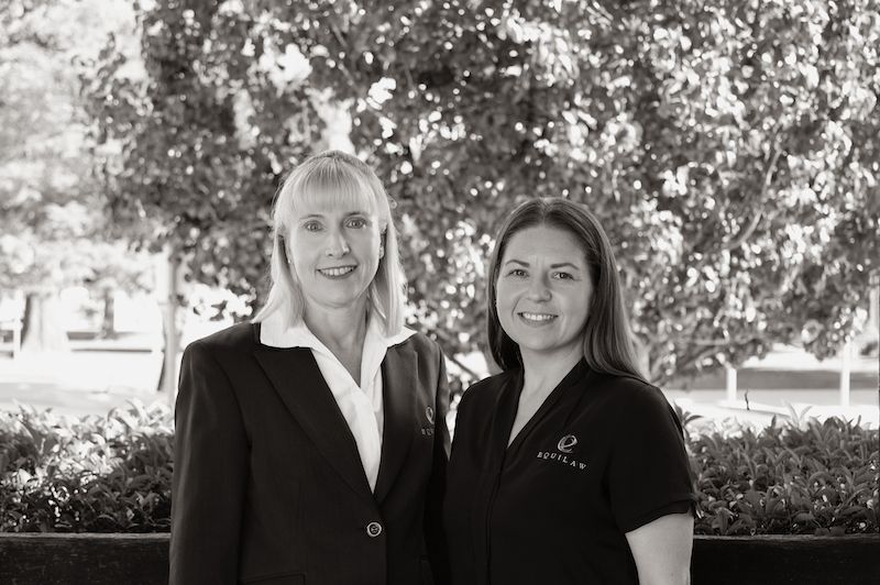 Attorney gives the client a pen to sign a contract — Solicitors in Muswellbrook NSW