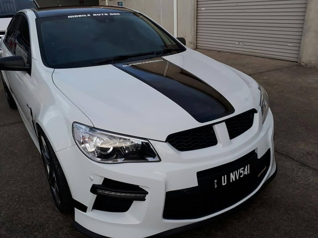 A White Car with A Black Stripe on The Hood — DNA Signs in Burleigh Heads, QLD