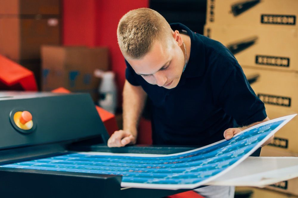 Man Printing — DNA Signs in Burleigh Heads, QLD