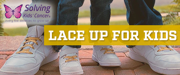 A couple of people standing next to each other with the words lace up for kids above them