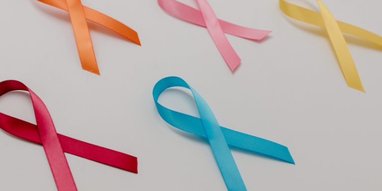 A group of colorful ribbons on a white surface.