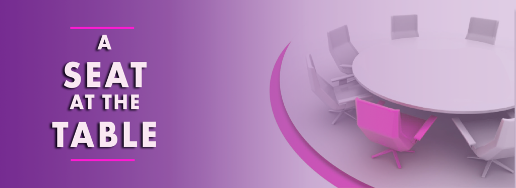 A purple banner with a round table and chairs and the words `` a seat at the table ''.