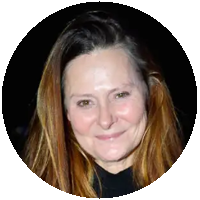 A woman with long brown hair is smiling in a circle.