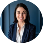 A woman in a suit and white shirt is smiling in a circle.