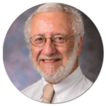 A man with a beard and glasses is smiling in a circle.