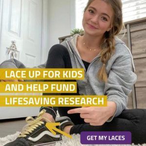 A girl is sitting on the floor and pointing at her shoes with the words lace up for kids and help fund lifesaving research