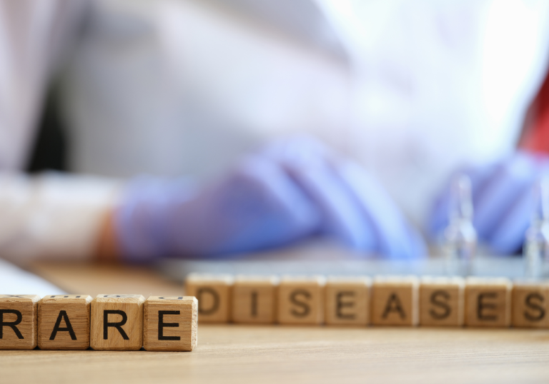 The word rare is written on wooden blocks on a table.