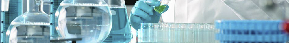 A close up of a person holding a test tube in a laboratory.