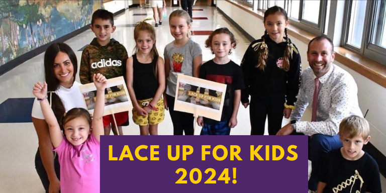 A group of children are holding a sign that says `` lace up for kids 2024 ''.