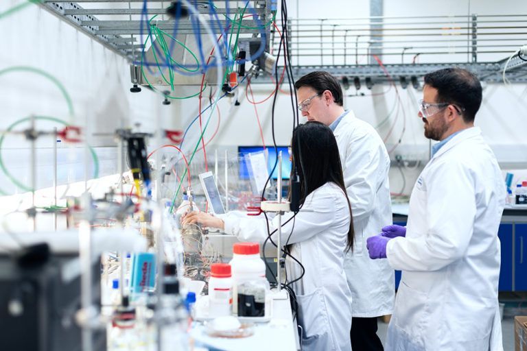 A group of scientists are working in a laboratory.