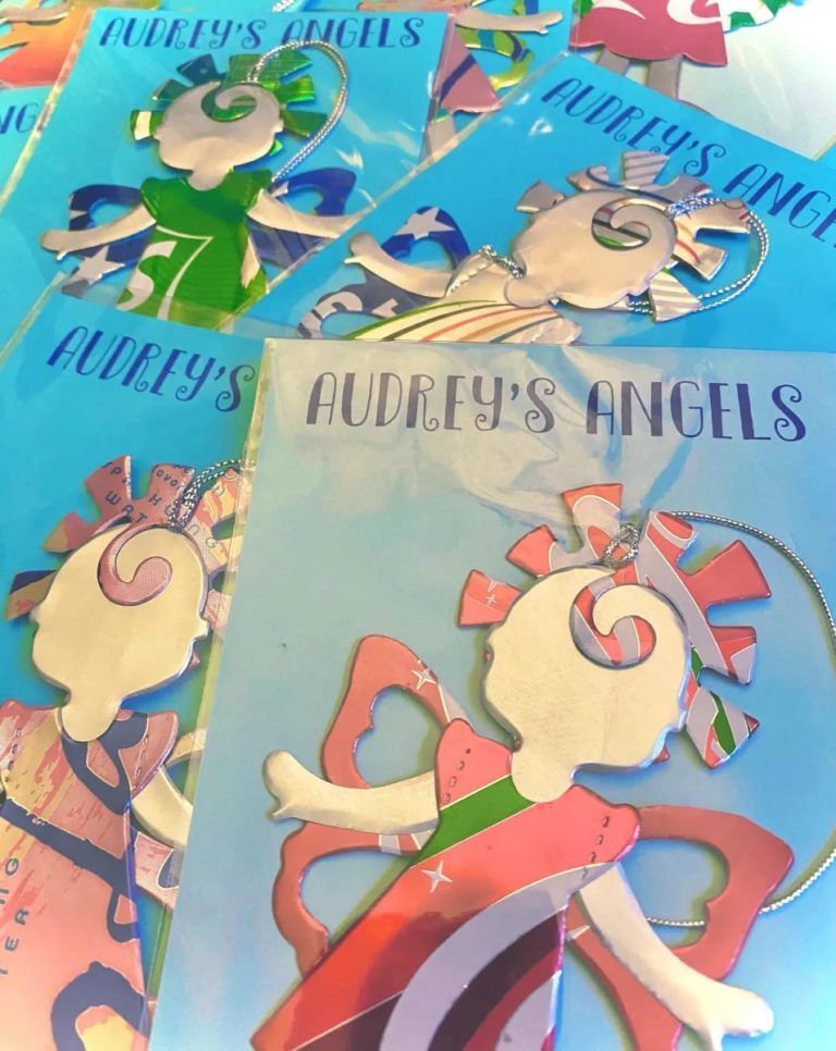 A book called audrey 's angels sits on a table