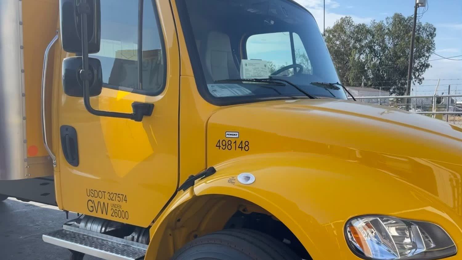 A yellow school bus is parked on the side of the road.