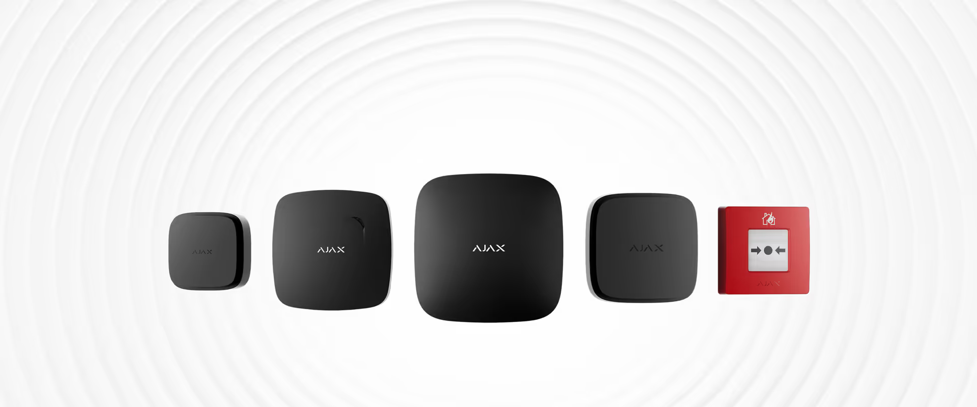 A Row Of Four Black Smart Home Sensors And One Red Manual Fire Alarm Pull Station On A Light Gray, Circular Lined Background — Cussler NQ in Bowen, QLD