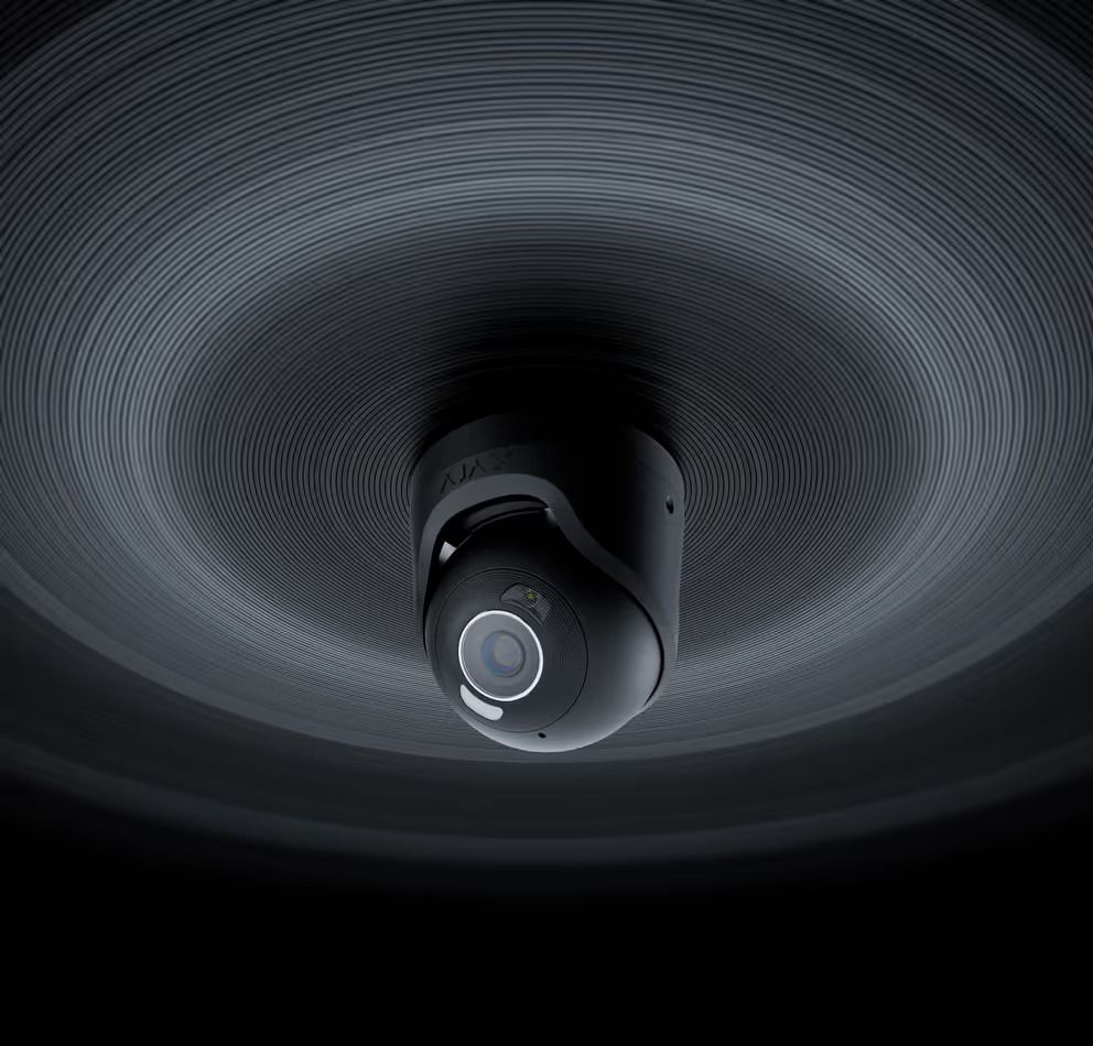 Black Security Camera Mounted on a Textured Ceiling, Emitting Concentric Light Rings — Cussler NQ in Mackay, QLD