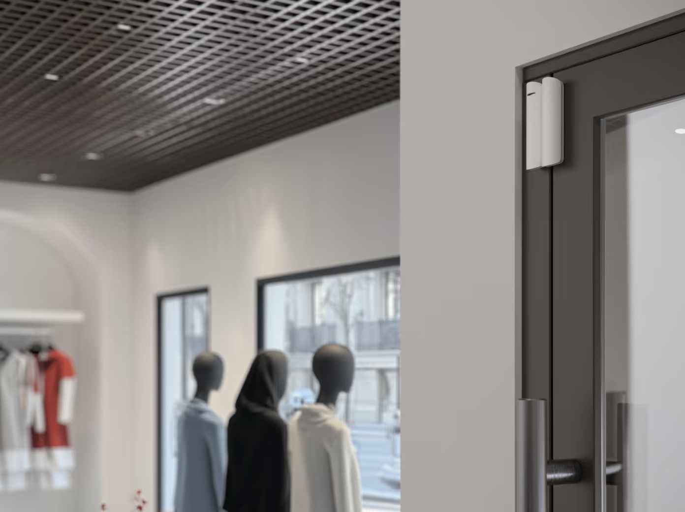 White Security Sensor on a Dark Door Frame in a Retail Store — Cussler NQ in Proserpine, QLD