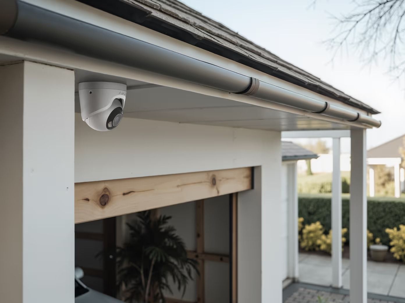Security Camera Mounted Under a White Eave, Above a Garage Door — Cussler NQ in Mackay, QLD