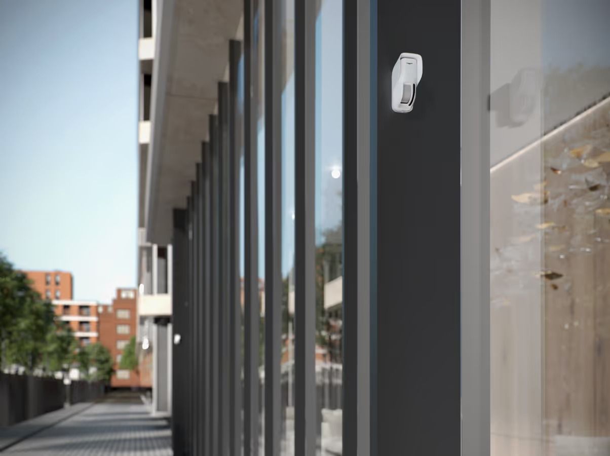 Security Camera Mounted on a Dark Building Exterior, Overlooking a Street With Glass Windows — Cussler NQ in Proserpine, QLD