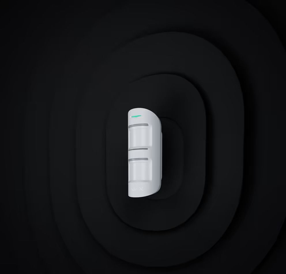 White Motion Sensor Against a Dark Gray Background With Concentric Oval Shapes — Cussler NQ in Hamilton Island, QLD