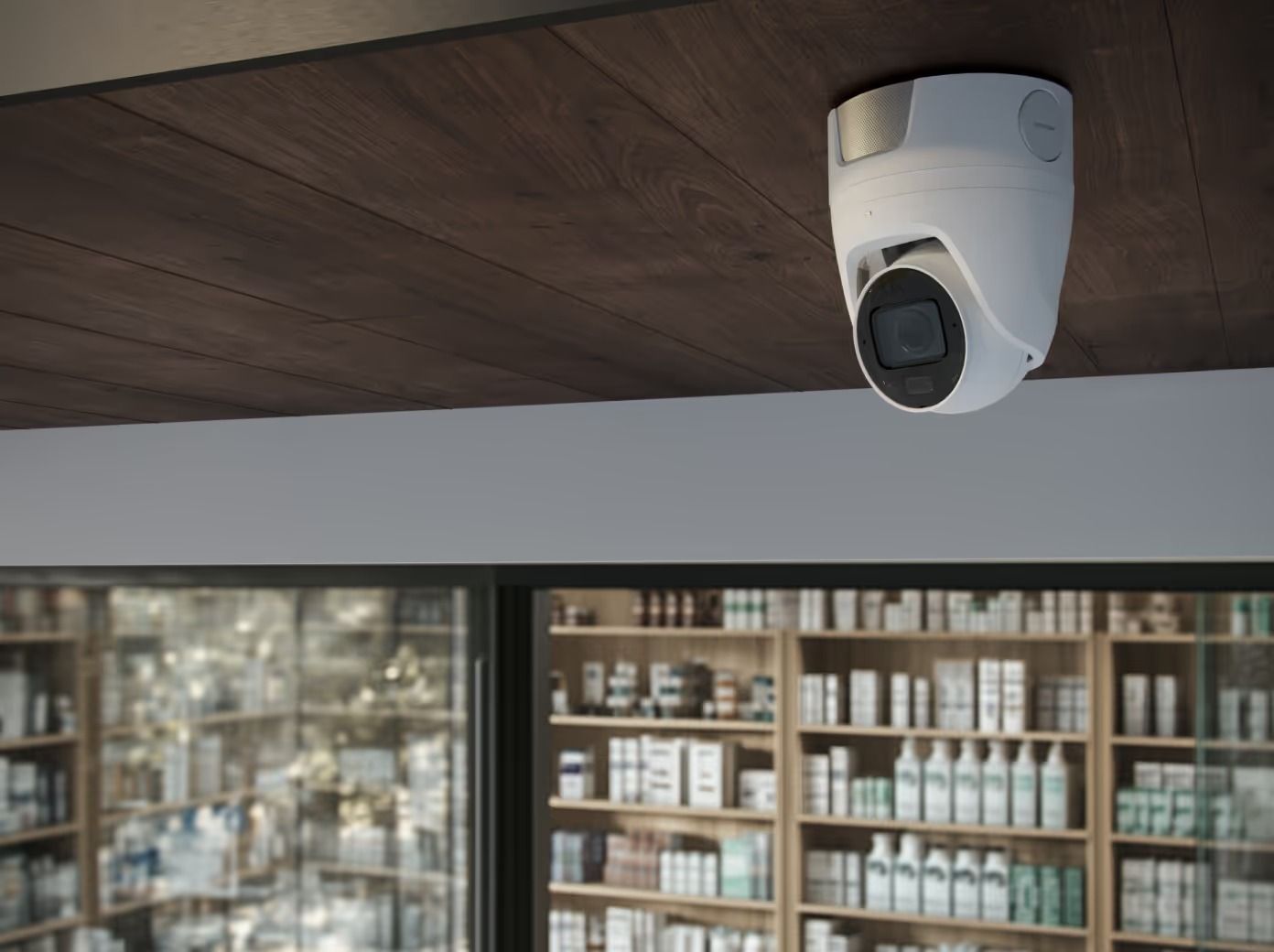 Security Camera Mounted on a Wood Ceiling, Looking Into a Pharmacy With Products on Shelves — Cussler NQ in Airlie Beach, QLD